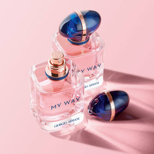 Two Giorgio Armani 'My Way' perfume bottles on a pink background