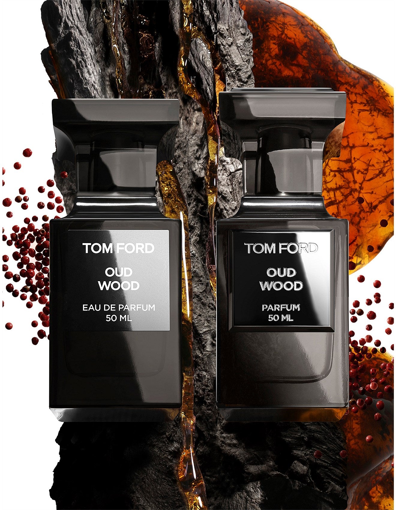 Two Tom Ford Oud Wood perfume bottles on a textured background