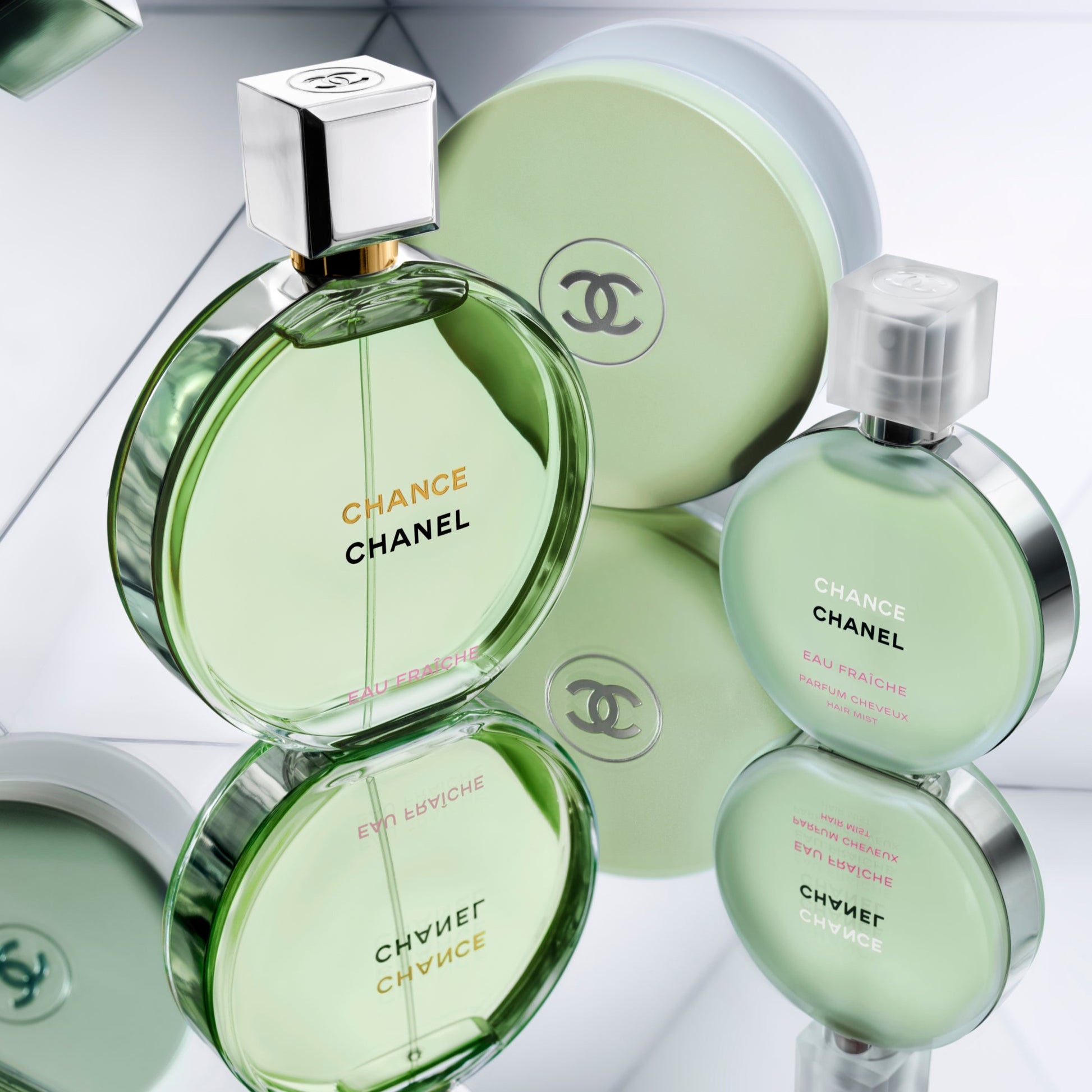 Chanel Chance perfume bottles on a light gray background
