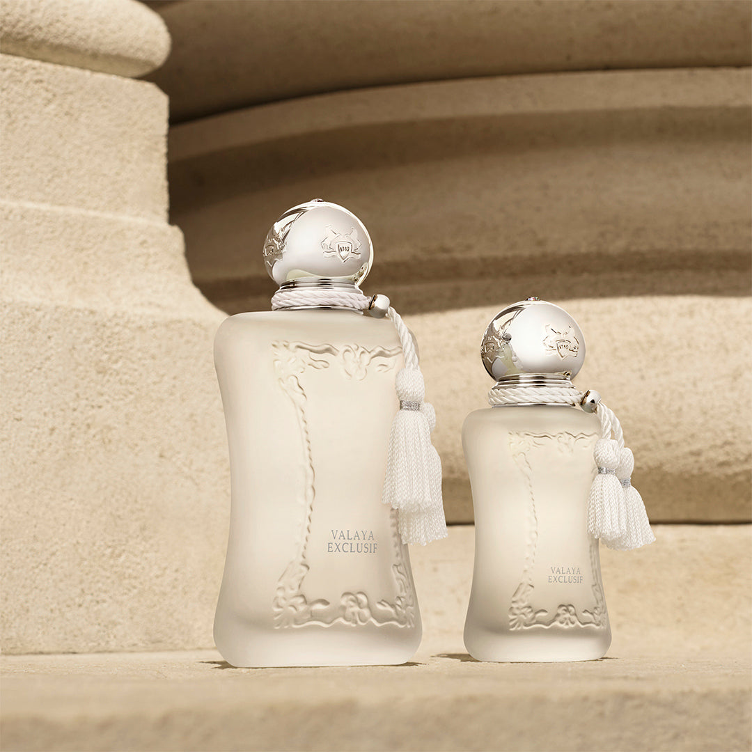 Valaya eau de parfum bottle by Parfums de Marly on a beige stone background