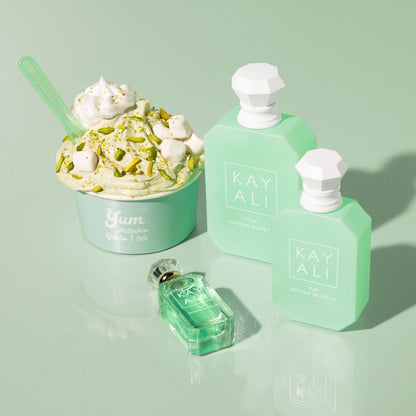 Green ice cream and KAYALI perfume bottles on a light green background