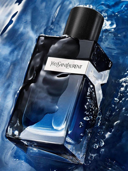 Yves Saint Laurent Y EDP perfume bottle on a blue water background
