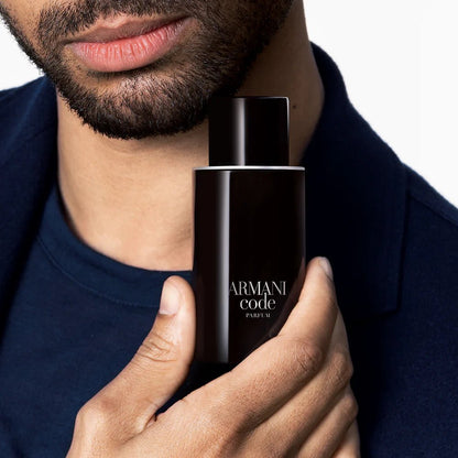 Regé-Jean Page holding Giorgio Armani Code Parfum 125ml bottle
