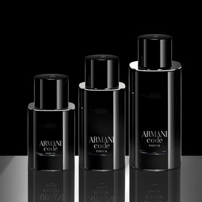 Three Armani Code perfume bottles on a reflective surface with a black background